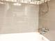 Sleek bathroom with neutral-toned tiling, modern fixtures, and a relaxing tub at 9650 Huron St # 3, Thornton, CO 80260