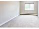 Cozy bedroom with plush carpet, window with neighborhood view, and neutral paint at 9650 Huron St # 3, Thornton, CO 80260