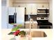 Updated kitchen features sleek stainless steel appliances, modern cabinetry, and stylish backsplash at 9650 Huron St # 3, Thornton, CO 80260
