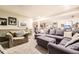 Finished basement featuring comfortable seating, carpet, and ample space for relaxation and entertainment at 2238 S Nome Ct, Aurora, CO 80014
