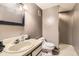 Small bathroom featuring a single sink, toilet and a shower area at 2238 S Nome Ct, Aurora, CO 80014