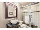 Modern bathroom showcasing a vessel sink, decorative mirror, and a glass-enclosed shower at 2238 S Nome Ct, Aurora, CO 80014