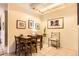 Well-lit dining area featuring a wooden table with seating for four and charming wall decor at 2238 S Nome Ct, Aurora, CO 80014