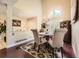 Elegant dining room with hardwood floors, chandelier, and large window, perfect for Gathering gatherings at 2238 S Nome Ct, Aurora, CO 80014
