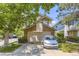 Charming two-story home with brick accents, driveway, and mature landscaping at 2238 S Nome Ct, Aurora, CO 80014