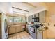 Well-lit kitchen with stainless steel appliances, granite countertops, and ample cabinet space for modern living at 2238 S Nome Ct, Aurora, CO 80014
