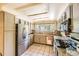 Well-lit kitchen with stainless steel appliances, granite countertops, and ample cabinet space for modern living at 2238 S Nome Ct, Aurora, CO 80014