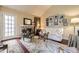 Comfortable living room with a decorative fireplace, vaulted ceilings, and warm hardwood flooring, ideal for relaxing at 2238 S Nome Ct, Aurora, CO 80014