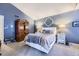 Comfortable bedroom features carpet, vaulted ceilings and decorative wall art above the bed at 2238 S Nome Ct, Aurora, CO 80014