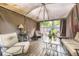 Covered patio area with comfortable seating and wood flooring at 2238 S Nome Ct, Aurora, CO 80014