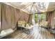 Inviting covered patio area with comfortable seating and wooden deck at 2238 S Nome Ct, Aurora, CO 80014