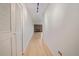 Hallway view of a living room with a brick fireplace and wood floors at 700 N Washington St # 402, Denver, CO 80203