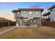 Backyard featuring a patio area with seating, perfect for relaxing and enjoying the outdoors at 2038 Meade St, Denver, CO 80211