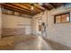 Unfinished basement featuring concrete walls and floors, ideal for storage or customization at 2038 Meade St, Denver, CO 80211