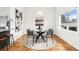 Bright dining area featuring modern table and chairs, complemented by unique artwork at 2038 Meade St, Denver, CO 80211