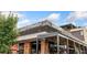 Stylish restaurant exterior with a covered patio and visible signage at 2038 Meade St, Denver, CO 80211