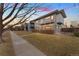 Modern home featuring minimalist design, neutral colors, and well-kept lawn at 2038 Meade St, Denver, CO 80211