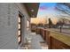 Inviting front door and walkway, with gray brick and modern fence detail at 2038 Meade St, Denver, CO 80211