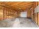 Clean and organized garage featuring concrete floors and wood-paneled walls at 2038 Meade St, Denver, CO 80211