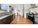 Spacious kitchen with modern appliances, sleek countertops, and stylish backsplash at 2038 Meade St, Denver, CO 80211