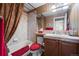 Bathroom featuring a single sink vanity and tub with shower at 3795 W 104Th Dr # E, Westminster, CO 80031