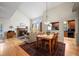 Elegant dining room with a fireplace, hardwood floors, and ample natural light at 3795 W 104Th Dr # E, Westminster, CO 80031