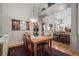 Open dining space with hardwood floors and view of kitchen and adjacent living area at 3795 W 104Th Dr # E, Westminster, CO 80031