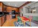 Cozy kitchen with dark appliances, wooden cabinets, and breakfast nook at 3795 W 104Th Dr # E, Westminster, CO 80031