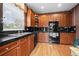 Well-lit kitchen with dark countertops, ample cabinetry, and modern appliances at 3795 W 104Th Dr # E, Westminster, CO 80031