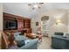 Loft living room featuring a built-in bookcase and seating area at 3795 W 104Th Dr # E, Westminster, CO 80031