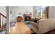 Bright living room featuring a fireplace, hardwood floors, and natural light at 3795 W 104Th Dr # E, Westminster, CO 80031