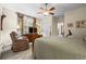 Spacious bedroom featuring a ceiling fan, media center and comfortable seating at 3795 W 104Th Dr # E, Westminster, CO 80031