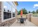 Charming stone patio with seating and umbrella, perfect for outdoor entertaining at 3795 W 104Th Dr # E, Westminster, CO 80031