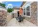 Inviting stone patio featuring a table and chairs for relaxing or dining al fresco at 3795 W 104Th Dr # E, Westminster, CO 80031