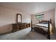 Bedroom featuring a window view and natural light, offering a serene and private retreat within the home at 7917 Chase Cir # 160, Arvada, CO 80003