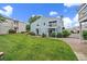 Charming blue townhouse with a well-manicured lawn and inviting curb appeal under a bright, sunny sky at 7917 Chase Cir # 160, Arvada, CO 80003