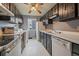 Well-arranged kitchen featuring ample cabinet storage and appliances, creating a practical and efficient cooking space at 7917 Chase Cir # 160, Arvada, CO 80003