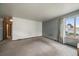 A sunlit living room with a large window offering neighborhood views and neutral paint, ready for personalization at 7917 Chase Cir # 160, Arvada, CO 80003