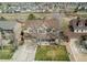 Charming two-story home with a front-facing garage, well-maintained lawn, and inviting covered porch at 22261 Pebble Brook Ln, Parker, CO 80138