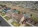 Beautiful aerial view of the homes with backyard basketball court and open space with walking path behind the property at 22261 Pebble Brook Ln, Parker, CO 80138