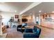 Multi-functional basement space with a bar area, TV, and cozy seating arrangement at 22261 Pebble Brook Ln, Parker, CO 80138