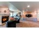 Spacious basement featuring a cozy fireplace and large screen TV for entertainment at 22261 Pebble Brook Ln, Parker, CO 80138