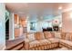 Open concept basement featuring a bar, fireplace, and comfortable seating area at 22261 Pebble Brook Ln, Parker, CO 80138