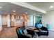 Basement area showcasing a stylish bar area and exercise equipment in the background at 22261 Pebble Brook Ln, Parker, CO 80138