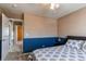 Relaxing bedroom with an open door leading to other parts of the home at 22261 Pebble Brook Ln, Parker, CO 80138