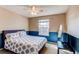 Comfortable bedroom with a white ceiling fan and natural light from the window at 22261 Pebble Brook Ln, Parker, CO 80138