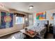 Unique bedroom with a grey bed and unique art on the walls at 22261 Pebble Brook Ln, Parker, CO 80138