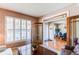 Cozy living room with a seamless view into the dining area and front entryway at 22261 Pebble Brook Ln, Parker, CO 80138