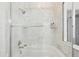 Bright bathroom with a marble tiled shower and bathtub at 2700 E Cherry Creek South Dr # 216, Denver, CO 80209