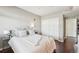 Bedroom featuring a plush bed with upholstered headboard and a large closet with sliding doors at 2700 E Cherry Creek South Dr # 216, Denver, CO 80209